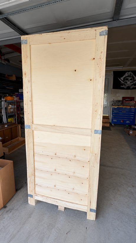 A crated, unplaced machine sitting in the garage